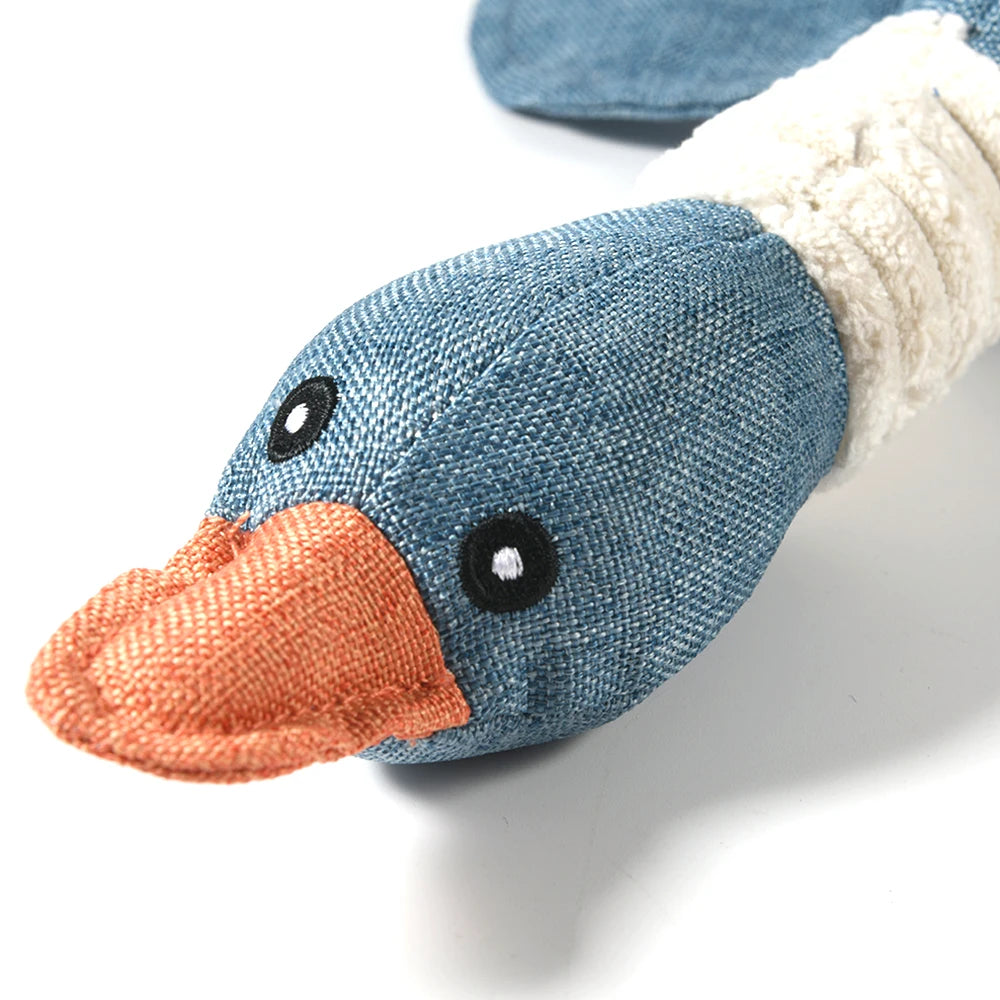 Close up of the face of the goose, tight stitching, embroidered eyes