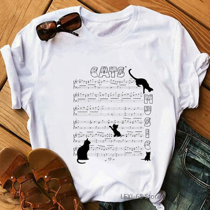 white t-shirt with black cats playing with musical notes, words on t-shirt say cats music