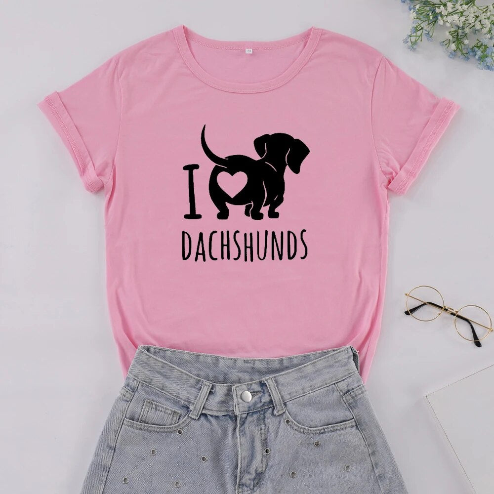 pink t-shirt with a black silhouette of a dachshund with the words I heart Dachshunds (picture of heart on the back end of dachshund)