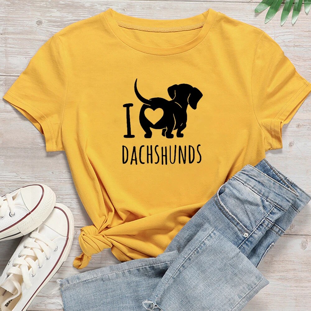 yellow t-shirt with a black silhouette of a dachshund with the words I heart Dachshunds (picture of heart on the back end of dachshund)