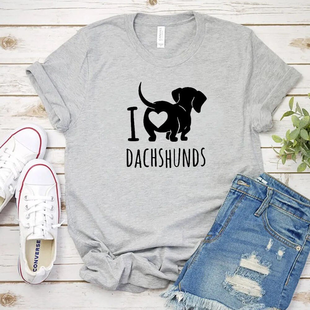grey t-shirt with a black silhouette of a dachshund with the words I heart Dachshunds (picture of heart on the back end of dachshund)