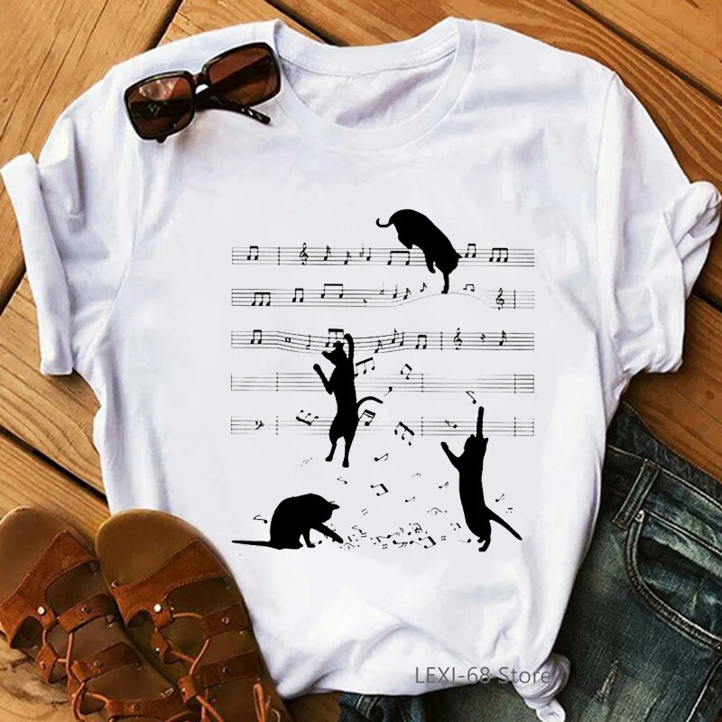 white t-shirt with black cats dangling from musical notes 