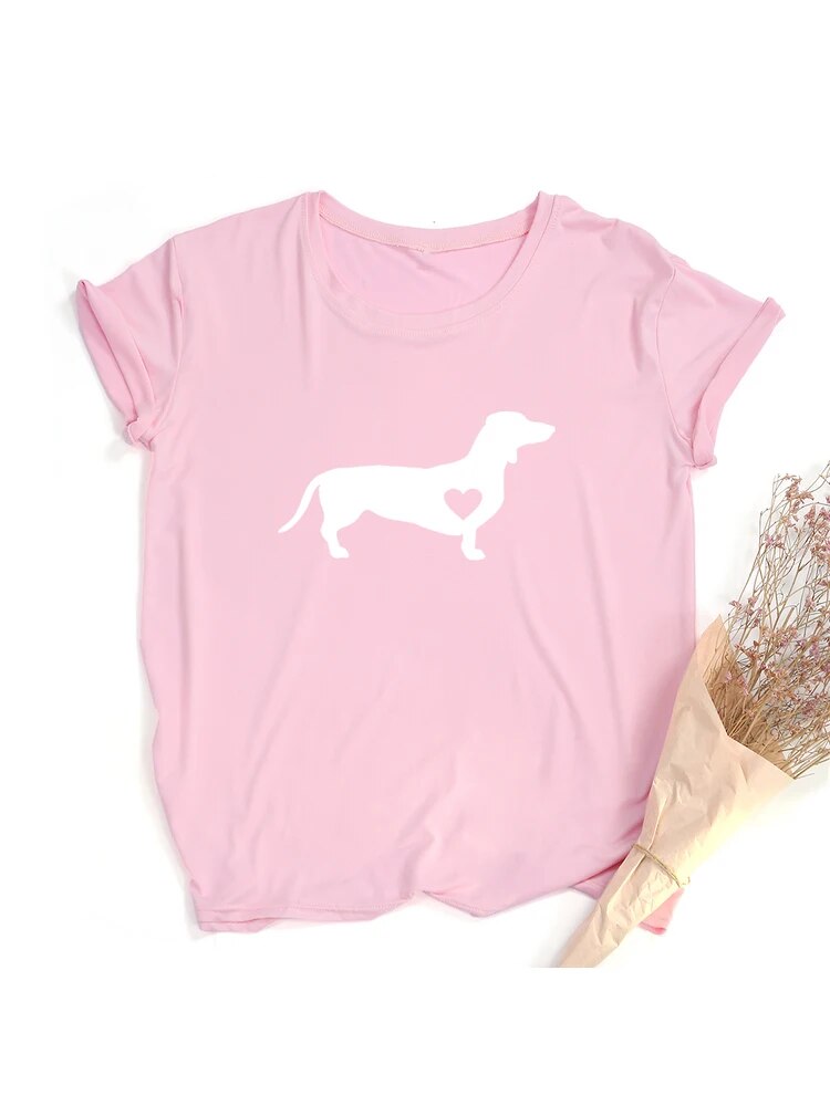 pink t-shirt with a white silhouette of a dachshund with a heart shape on the dog