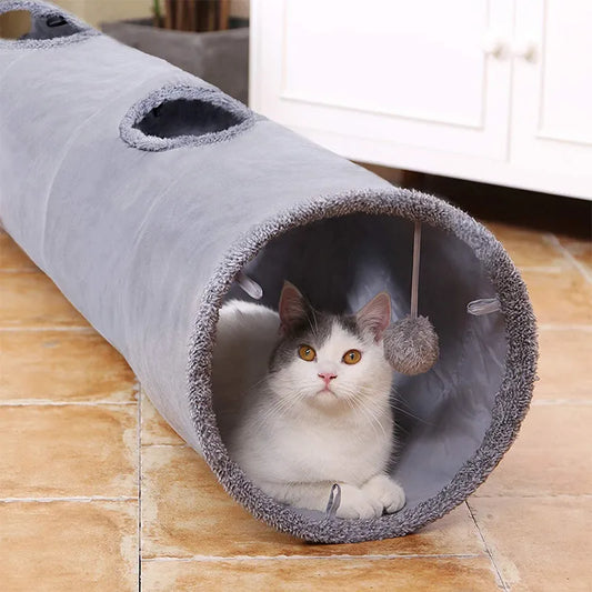 Collapsible cat tunnel, grey material, holes on the top, ball hangs from the opening