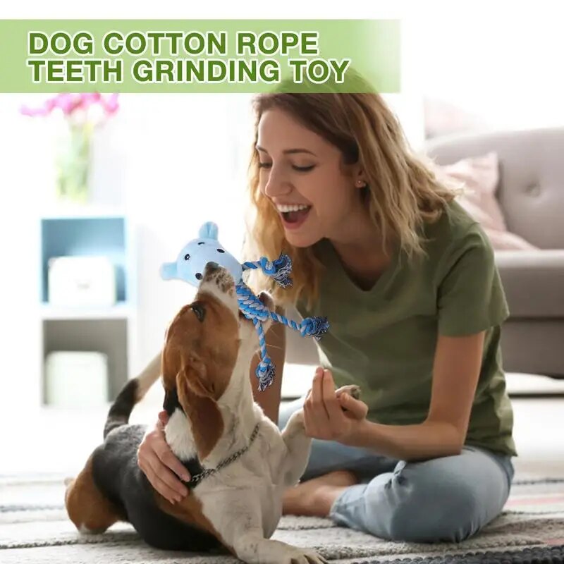 dog playing with the cow in its mouth, words say, dog cotton rope teeth grinding toy